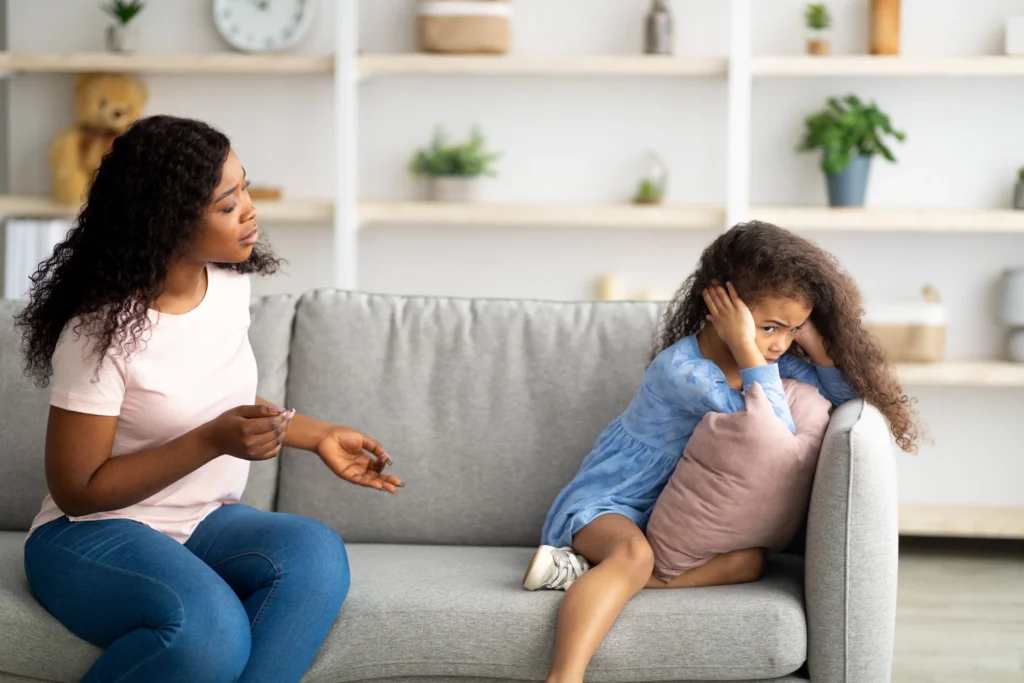 A mother speaking with an upset child.
