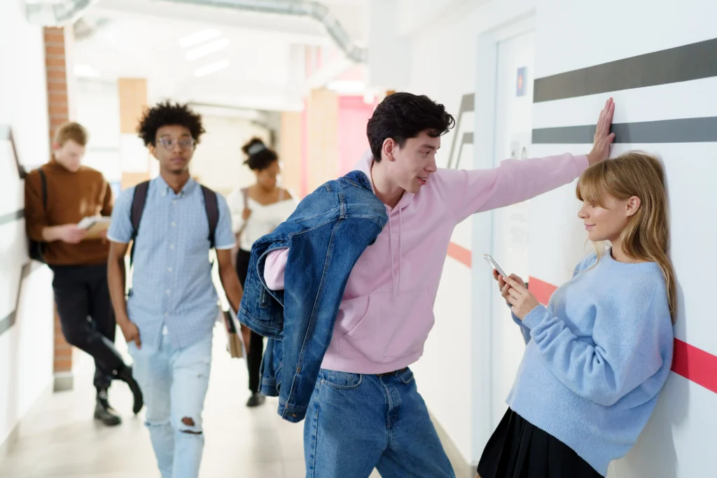College students walking around a school hallway.